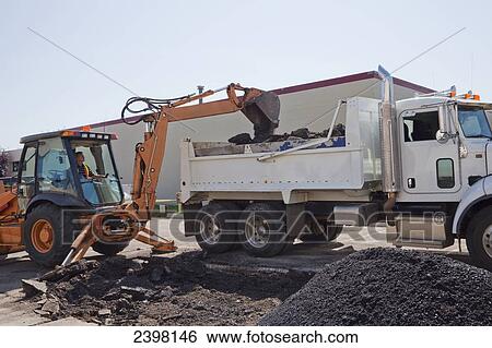 Work crew repairing pot holes in a parking lot; Edmonton, Alberta, Canada View Large Photo Image Stock Photograph - Work crew repairing pot holes in a parking lot; Edmonton, Alberta, Canada. Fotosearch
