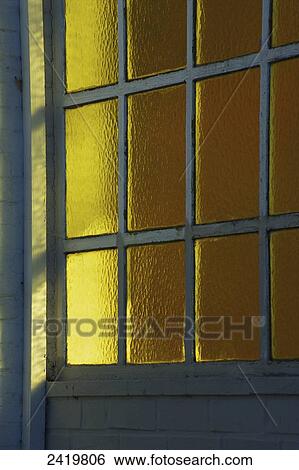 Stock Photograph - Yellow tinted windows; Hamburg, Germany. Fotosearch