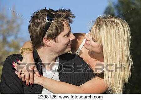 Young couple in love; Edmonton, Alberta, Canada View Large Photo Image Stock Photograph - Young couple in love; Edmonton, Alberta, Canada. Fotosearch