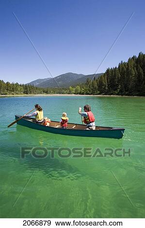 Young Family Canoeing On Loon Lake In The East Kootenays, British Columbia, Canada View Large Photo Image Stock Photo - Young Family Canoeing On Loon Lake In The East Kootenays, British Columbia, Canada. Fotosearch