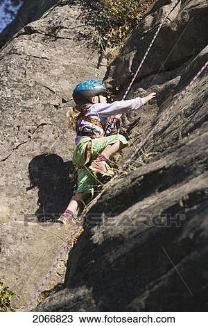 Young Girl (Age 5) Climbing On Granite Cliff At Stone Hills Near Rexford, Montana, Usa View Large Photo Image Stock Image - Young Girl (Age 5) Climbing On Granite Cliff At Stone Hills Near Rexford, Montana, Usa. Fotosearch