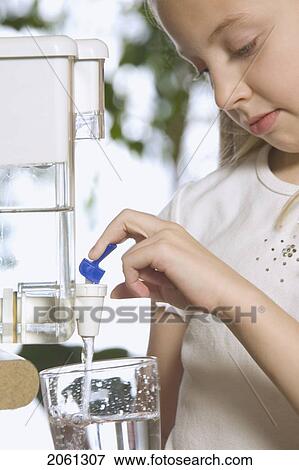 Young Girl Pouring Filtered Water View Large Photo Image Stock Photo - Young Girl Pouring Filtered Water. Fotosearch