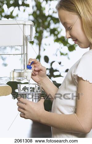 Young Girl Pouring Filtered Water View Large Photo Image Stock Photo - Young Girl Pouring Filtered Water. Fotosearch