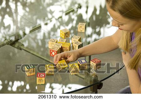 Young Girl Spelling Recycle With Alphabet Blocks View Large Photo Image Stock Image - Young Girl Spelling Recycle With Alphabet Blocks. Fotosearch