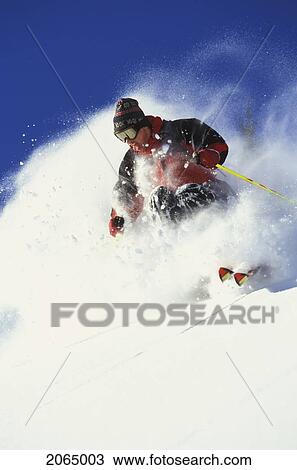 Young Man Skiing Fresh Powder On Steep Slope At Island Lake Resort, Fernie, British Columbia, Canada. View Large Photo Image Stock Image - Young Man Skiing Fresh Powder On Steep Slope At Island Lake Resort, Fernie, British Columbia, Canada.. Fotosearch