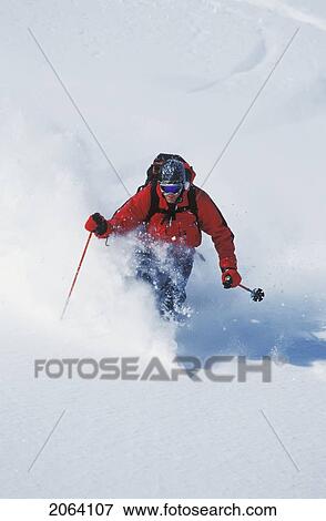 Stock Photo - Young Man Skiing Untracked Powder In The Backcountry Near Fernie, British Columbia, Canada. Fotosearch