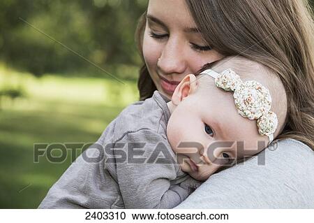 Young mother with her baby daughter; Edmonton, Alberta, Canada View Large Photo Image Stock Image - Young mother with her baby daughter; Edmonton, Alberta, Canada. Fotosearch