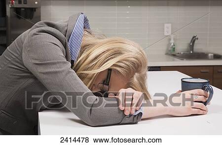 Young office worker asleep in the coffee room; Edmonton, Alberta, Canada View Large Photo Image Stock Photo - Young office worker asleep in the coffee room; Edmonton, Alberta, Canada. Fotosearch