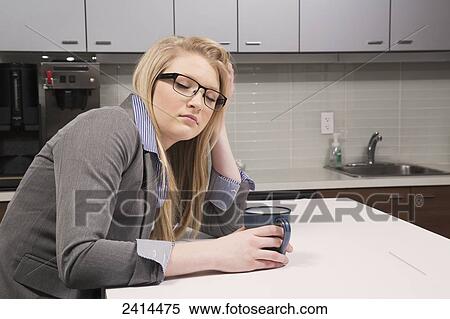 Young office worker asleep in the coffee room; Edmonton, Alberta, Canada View Large Photo Image Stock Photography - Young office worker asleep in the coffee room; Edmonton, Alberta, Canada. Fotosearch