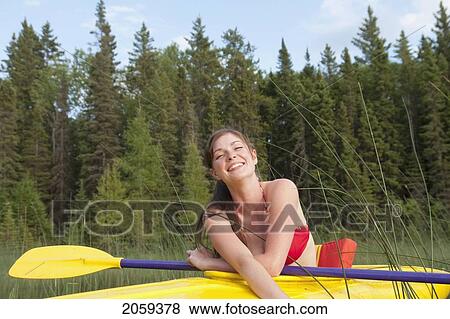 Young Woman In Yellow Kayak, Lake Katherine, Riding Mountain National Park, Manitoba, Canada View Large Photo Image Stock Photo - Young Woman In Yellow Kayak, Lake Katherine, Riding Mountain National Park, Manitoba, Canada. Fotosearch