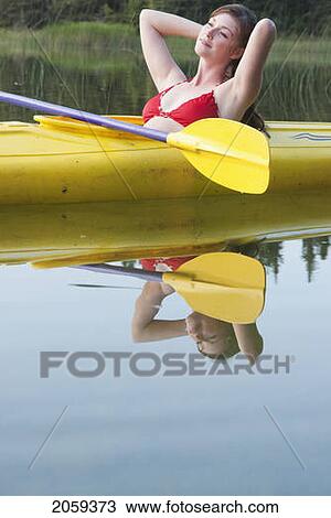 Young Woman Leans Back In Kayak On Lake Katherine, Riding Mountain National Park, Manitoba, Canada View Large Photo Image Stock Image - Young Woman Leans Back In Kayak On Lake Katherine, Riding Mountain National Park, Manitoba, Canada. Fotosearch