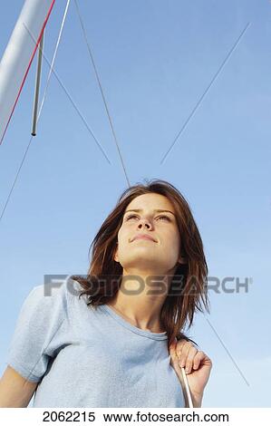Young Woman Looking Upward, On Sail Boat, Wearing Hemp Shirt, Clear Lake, Riding Mountain National Park, Manitoba, Canada View Large Photo Image Stock Photography - Young Woman Looking Upward, On Sail Boat, Wearing Hemp Shirt, Clear Lake, Riding Mountain National Park, Manitoba, Canada. Fotosearch