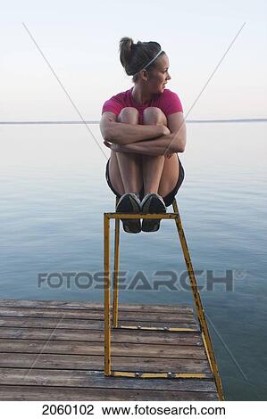 Young Woman Seated On Dock Ladder, Clear Lake, Riding Mountain National Park, Mantioba, Canada View Large Photo Image Stock Image - Young Woman Seated On Dock Ladder, Clear Lake, Riding Mountain National Park, Mantioba, Canada. Fotosearch