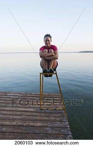 Young Woman Seated On Dock Ladder, Clear Lake, Riding Mountain National Park, Mantioba, Canada View Large Photo Image Stock Image - Young Woman Seated On Dock Ladder, Clear Lake, Riding Mountain National Park, Mantioba, Canada. Fotosearch