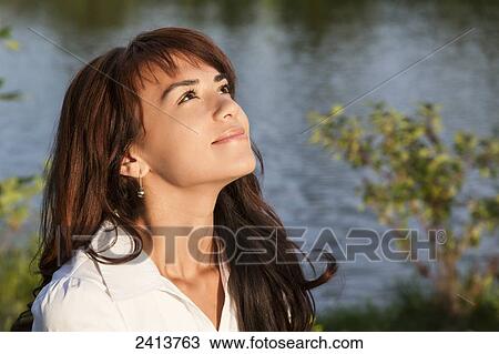 Young woman taking time for herself in a park; Edmonton, Alberta, Canada View Large Photo Image Stock Image - Young woman taking time for herself in a park; Edmonton, Alberta, Canada. Fotosearch
