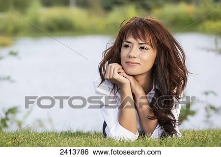 Young woman taking time for herself in a park; Edmonton, Alberta, Canada View Large Photo Image Stock Photograph - Young woman taking time for herself in a park; Edmonton, Alberta, Canada. Fotosearch