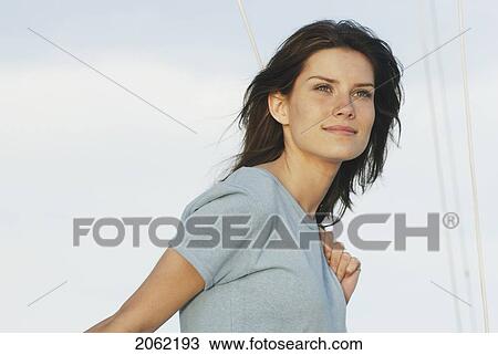 Young Woman Wearing Hemp Shirt Holds Rope On Sailboat, Clear Lake, Riding Mountain National Park, Manitoba, Canada View Large Photo Image Stock Image - Young Woman Wearing Hemp Shirt Holds Rope On Sailboat, Clear Lake, Riding Mountain National Park, Manitoba, Canada. Fotosearch