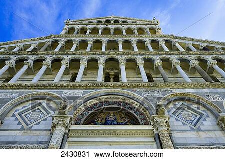 Stock Image - A building with pillars and ornate facade; Pisa, Tuscany, Italy. Fotosearch
