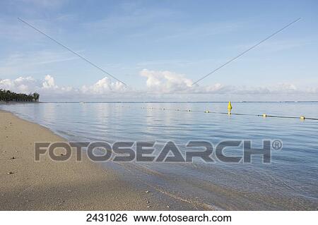 Stock Photograph - A designated swimming area off the beach; Mauritius. Fotosearch