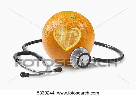 Picture - A heart shape cut into a orange with a stethoscope. Fotosearch