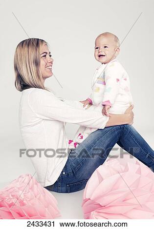 A mother poses with her baby daughter; Tarifa, Cadiz, Andalusia, Spain View Large Photo Image Stock Image - A mother poses with her baby daughter; Tarifa, Cadiz, Andalusia, Spain. Fotosearch