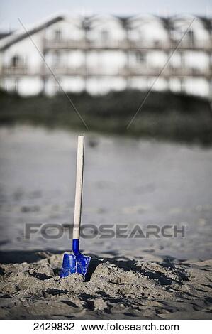 A play shovel in the sand; Cannon Beach, Oregon, United States of America View Large Photo Image Stock Image - A play shovel in the sand; Cannon Beach, Oregon, United States of America. Fotosearch