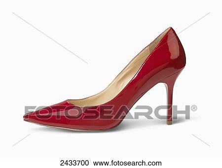 Stock Image - A red high heeled shoe on a white background. Fotosearch