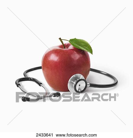 A stethoscope around a red apple on a white background View Large Photo Image Stock Image - A stethoscope around a red apple on a white background. Fotosearch