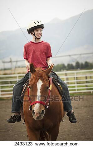 A young boy rides his horse at Eagle Mount; Bozeman, Montana, United States of America View Large Photo Image Stock Image - A young boy rides his horse at Eagle Mount; Bozeman, Montana, United States of America. Fotosearch