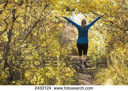 A young woman hiking on Sypes trail near Bozeman; Montana, United States of America View Large Photo Image Picture - A young woman hiking on Sypes trail near Bozeman; Montana, United States of America. Fotosearch