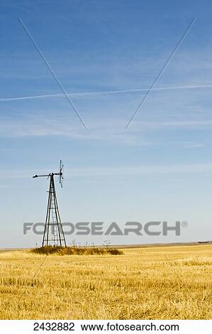 Stock Image - Abandoned windmill in a wheat field in Carson County; South Dakota, United States of America. Fotosearch