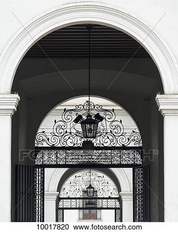 Stock Image - Archways with ornate designs on metal gate; Santiago, Santiago Metropolitan Region, Chile. Fotosearch