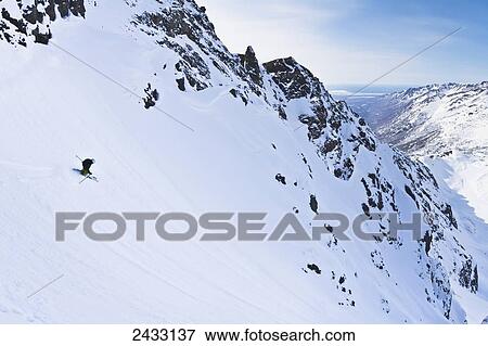 Stock Photo - Backcountry ski mountaineering near Eagle River, Western Chugach Mountains, Southcentral Alaska; Alaska, United States of America. Fotosearch
