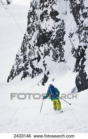 Stock Photograph - Backcountry ski mountaineering near Eagle River, Western Chugach Mountains, Southcentral Alaska; Alaska, United States of America. Fotosearch