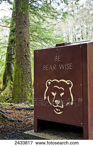 Stock Photo - Bear proof trash can at Totem Trail, Sitka National Historical Park; Sitka, Alaska, United States of America. Fotosearch
