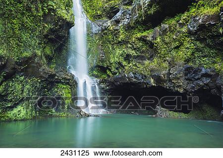 Stock Photography - Beautiful lush waterfall on the road to Hana; Haiku, Maui, Hawaii, United States of America. Fotosearch