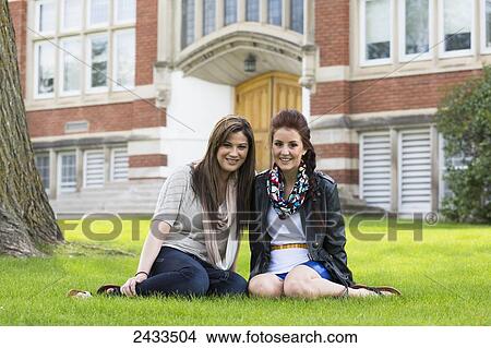Best friends posing for a picture in a school yard; Edmonton, Alberta, Canada View Large Photo Image Picture - Best friends posing for a picture in a school yard; Edmonton, Alberta, Canada. Fotosearch