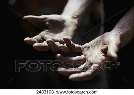 Stock Image - Blacksmith's hands; Metchosin, British Columbia, Canada. Fotosearch