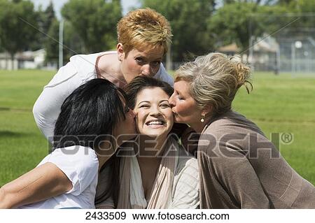 Stock Photo - Bride-to-be spending quality time with her mother, stepmother and mother-in-law; Edmonton, Alberta, Canada. Fotosearch