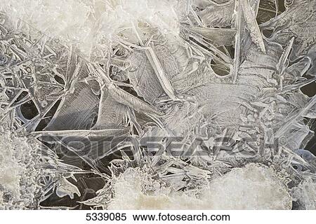 Brittle ice forming along the banks of the Porcupine river during a cool spring morning; Old Crow, Yukon, Canada View Large Photo Image Stock Photography - Brittle ice forming along the banks of the Porcupine river during a cool spring morning; Old Crow, Yukon, Canada. Fotosearch