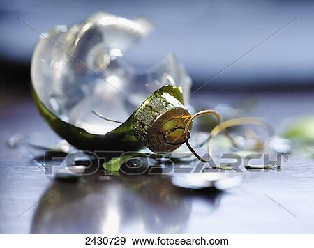 Stock Photo - Broken Christmas ornament on a wooden floor; Montreal, Quebec, Canada. Fotosearch