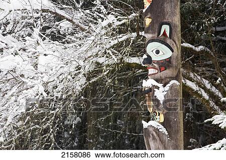 Stock Photograph - Brown Bear Totemic Figure On Tlingit Totem Pole At Auke Bay Recreation Area.. Fotosearch