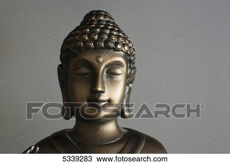 Buddha head against a grey background View Large Photo Image Stock Image - Buddha head against a grey background. Fotosearch