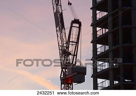 Building under construction at sunrise; London, England View Large Photo Image Stock Image - Building under construction at sunrise; London, England. Fotosearch