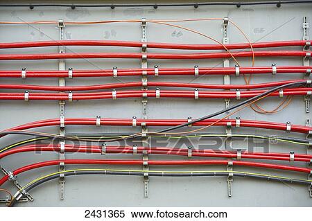 Cables lining a wall; London, England View Large Photo Image Stock Photography - Cables lining a wall; London, England. Fotosearch