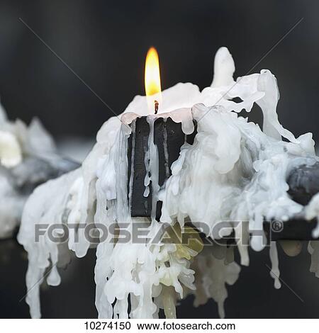 Stock Image - Candle burning with hardened wax drippings, San Cristobal Hill; Santiago, Santiago Metropolitan Region, Chile. Fotosearch