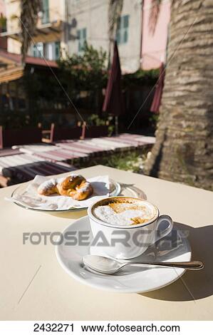Cappuccino served on a table; Porto Venere, Liguria, Italy View Large Photo Image Stock Image - Cappuccino served on a table; Porto Venere, Liguria, Italy. Fotosearch