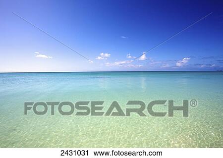 Clear turquoise ocean water towards the horizon and blue sky; Vamizi Island, Mozambique View Large Photo Image Stock Image - Clear turquoise ocean water towards the horizon and blue sky; Vamizi Island, Mozambique. Fotosearch