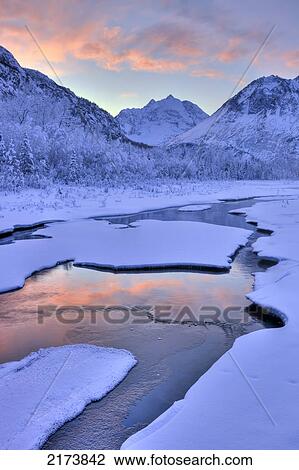 Stock Image - Colorful Sunrise Over A Stream At The Eagle River Nature Center In Chugach State Park, Southcentral Alaska, Winter, Hdr. Fotosearch