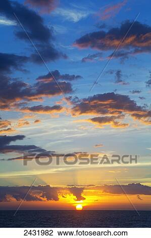 Stock Image - Colourful sunset at Keawekapu Beach; Kihei, Maui, Hawaii, United States of America. Fotosearch